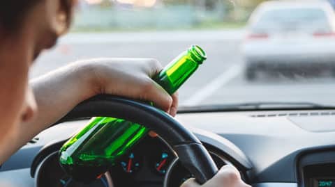 Man-Driving-While-Drinking-Wondering-If-He'll-Need-a-DWI-Lawyer