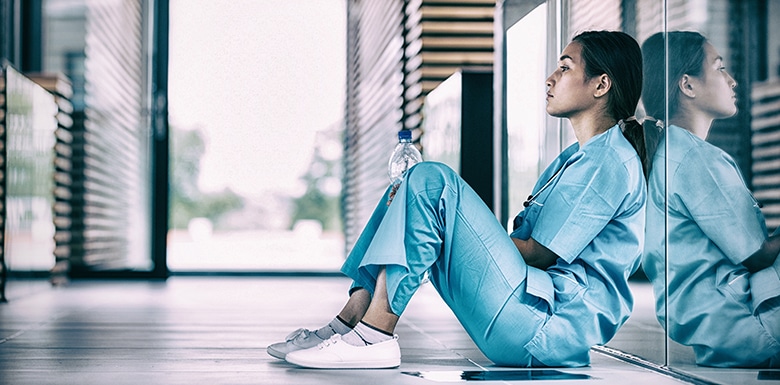 Nurse sitting in a hospital hallway