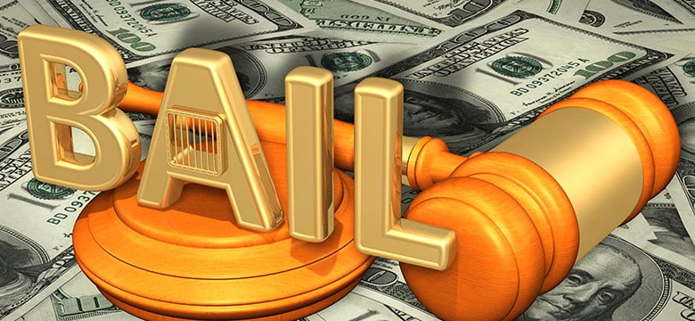 Gavel and stand saying "bail" on top of a pile of money