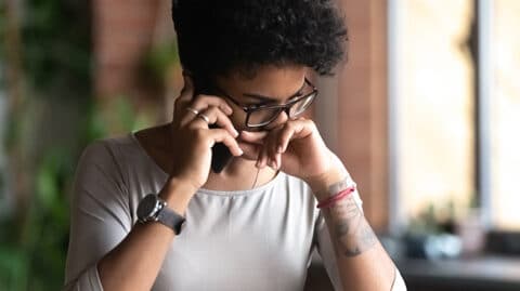 Woman upset while on the phone