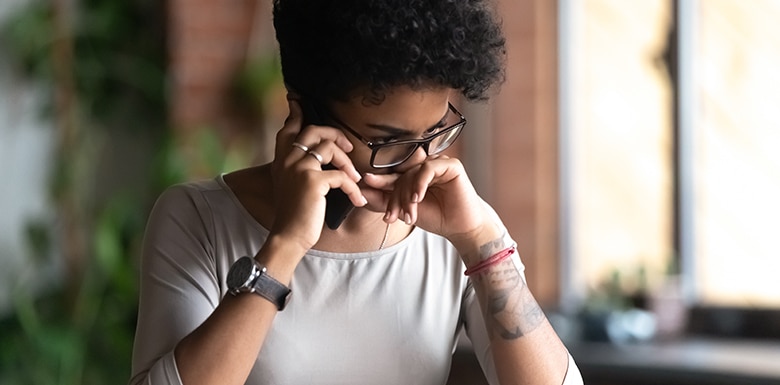 Woman upset while on the phone